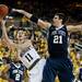 Michigan freshman Nik Stauskas shoots while defended by Penn State junior Sasa Borovnjak on Sunday, Feb. 17. Daniel Brenner I AnnArbor.com